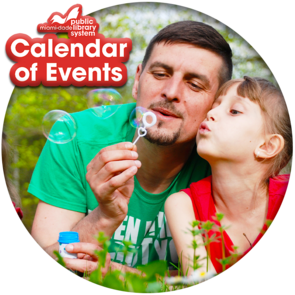 A father and his daughter blowing bubbles in the park