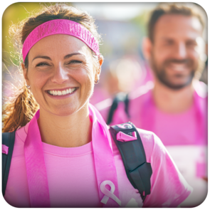 Two people walking together in a breast cancer awareness event