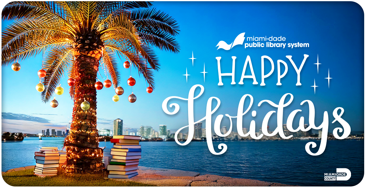 A Christmas tree adorned with lights and ornaments, surrounded by books on a coastal shore, with the Miami skyline visible across the water