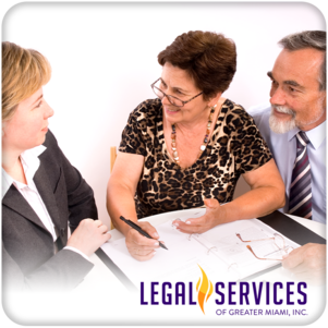 Mature couple talking to financial planner