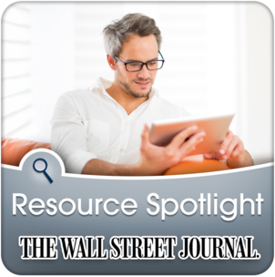 Man reading iPad on couch