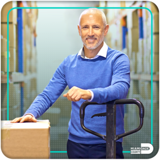 Vendor with dolly in warehouse