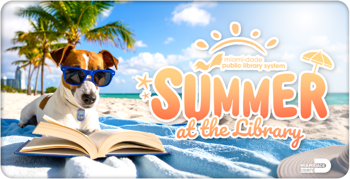 Dog wearing sunglasses reading a book at the beach