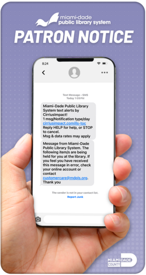 Hand holding smartphone displaying text alert