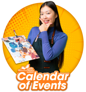 Female artist smiling, holding a paint palette