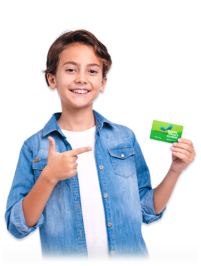 Young boy holding library card