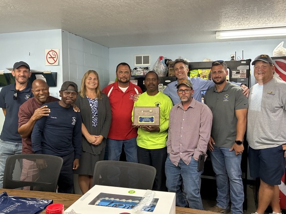 Group photo of Michael Meridith with Public Works & Utilities staff and City Manager Jenni Lamb