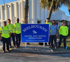 A photo of employees with promotions in water distribution