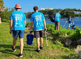 Volunteers cleaning along the banks at Ballard Park