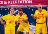 adults smiling in dodgeball halloween costumes