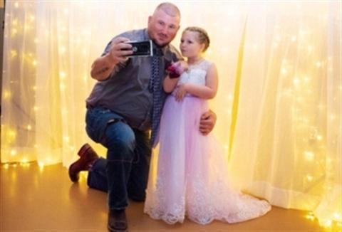 Father and daughter take a selfie