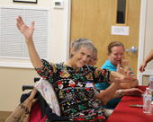A senior enjoys her time at the Senior Giving Tree event