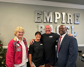 Mayor Alice White and City Manager Jerome Fletcher pose with the owners of Empire Bagel