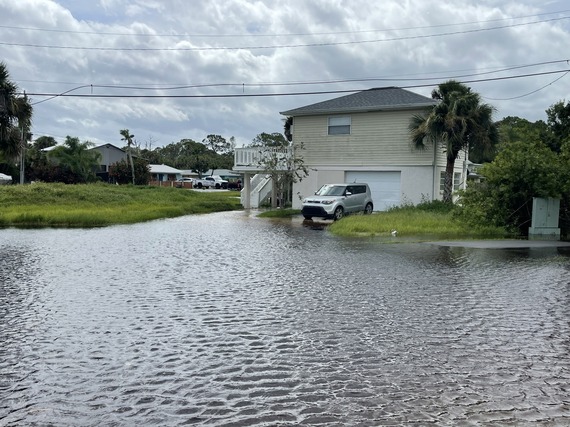 Rising waters by a house in Tarpon Point, North Port FL