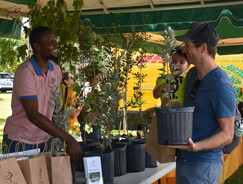 Indyli Brown at Earth Day Event giving out trees