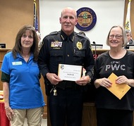 plantation womans club presents check to police