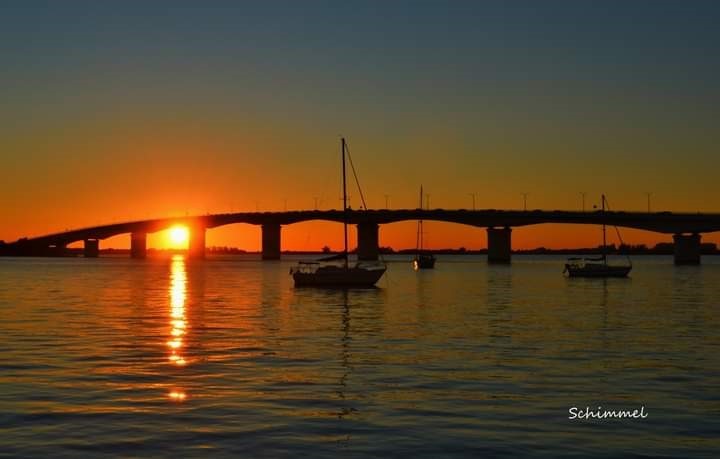 Schimmel - sunset with sailboat