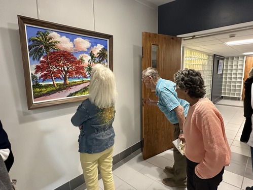 Florida Highwaymen - attendees viewing painting