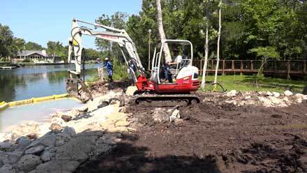 Excavator working on shoreline