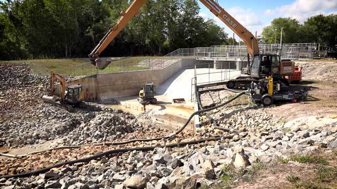 Construction equipment at water control structure