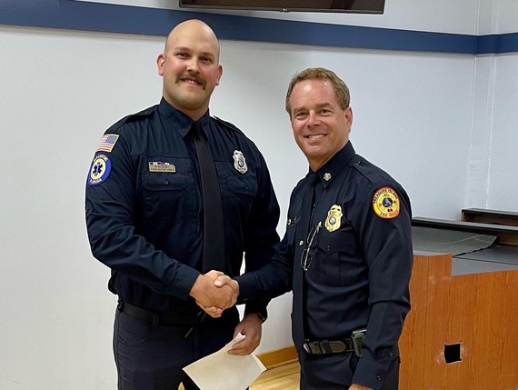 Firefighter/Paramedic Pat Klemba Honored by Chief Trip Barrs at City Commission Meeting for saving the life of a man in cardiac arrest