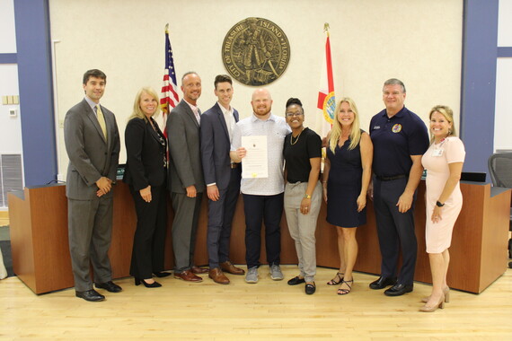 Nurses and City Commissioners pose with proclamation for National Nurses Week