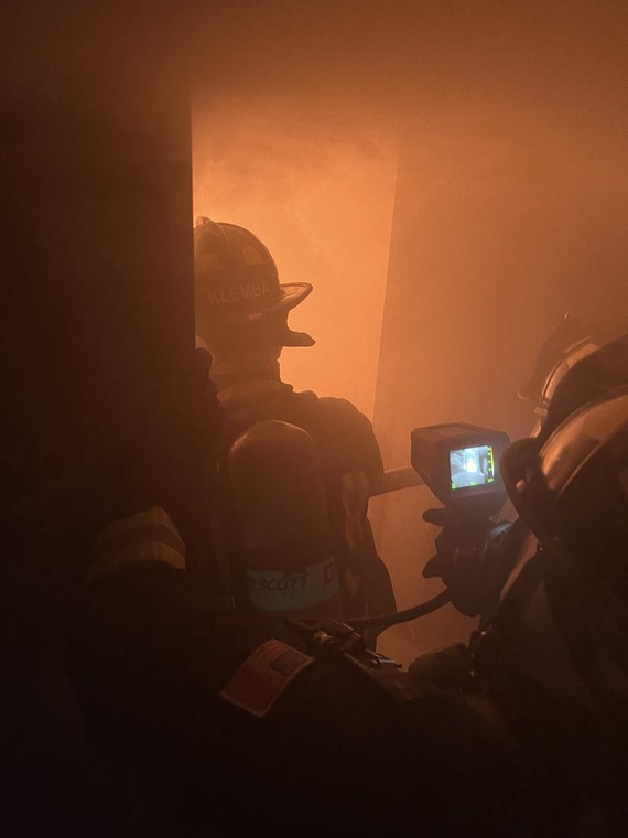 Treasure Island Fire Fighters in burning building doing training