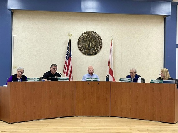 Wide shot picture of entire City Commission on the dias with addition of Commissioner Minning