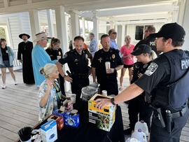 TIPD officers chatting with susnet beach residents