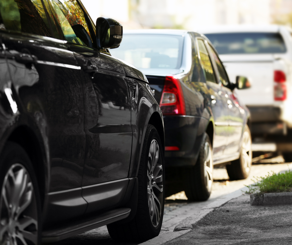 Vehicles parked along a side street