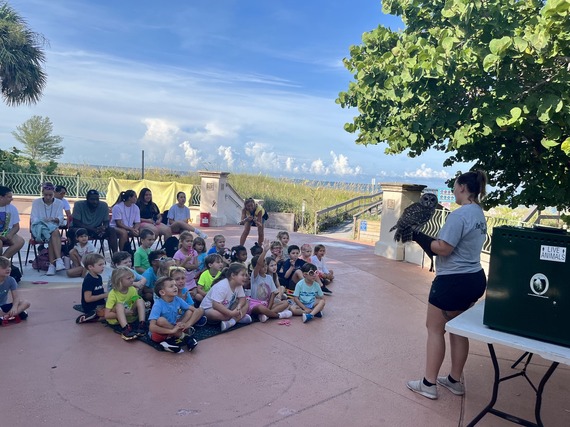 Treasure Island summer campers listening to a presentation from Seaside Seabird Sanctuary