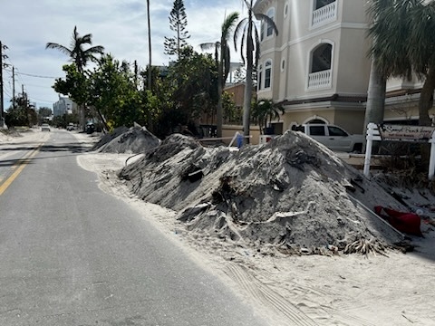 Sand piles on city right-of-way