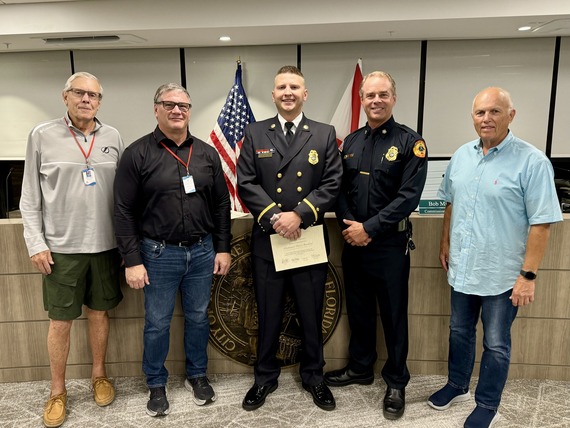 Treasure Island Fire Rescue Lieutenant Rowland with Chief Barrs and city commissioners
