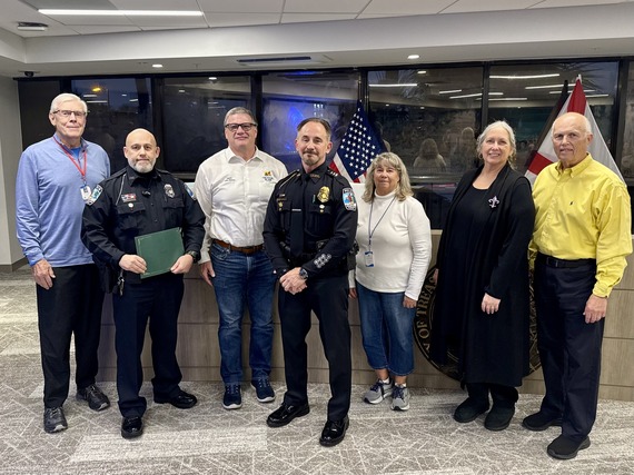 Officer Darren Chiaputti with City Commission for recognition of 25 years of service