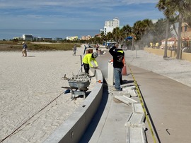 Crews working on repairing the Beach Trail wall