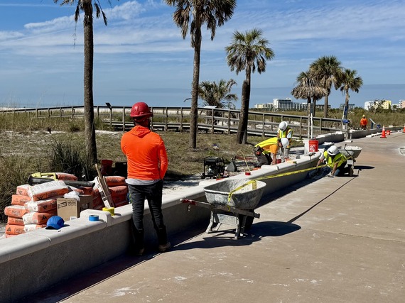 Crews working on damage Beach Trail wall