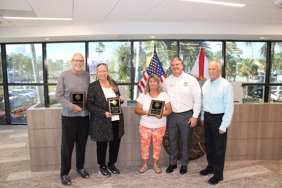 Commissioners leaving receiving plaques after leaving