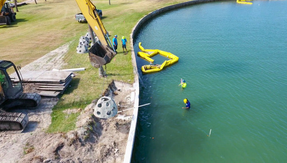 Aerial shot of oyster beds being laid along living shoreline at Treasure Bay