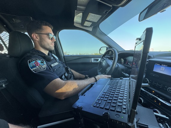 Treasure Island Police Officer Pavlovic on patrol in police car