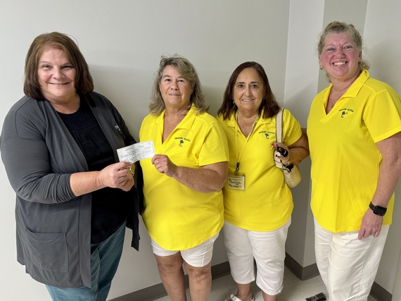 Members of the Treasure Islettes and Parks and Reacreation Director Cathy Hayduke pose with 2,500 dollar check donation