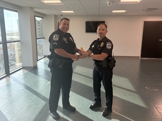 Sgt Citrano accepts seargeant badge from Chif Barkley