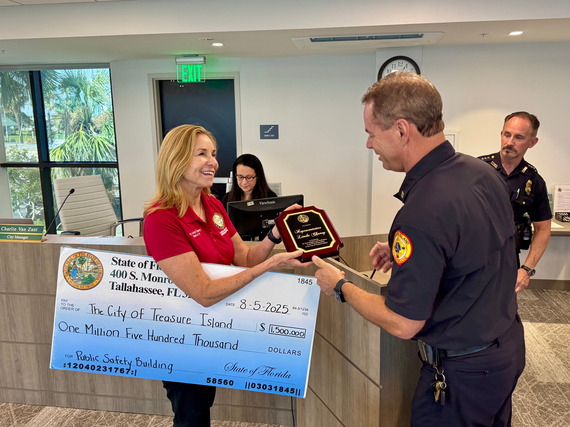 TIFR Chief Trip Barrs and TIPD Chief John Barkley presented Representative Chaney with a commemorative plaque 