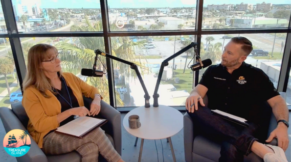 Two city employees sitting in chars doing a podcast