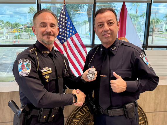 Treasure Island Police Officer Nascimento pictured with Chief Barkley after being sworn in and receiving his badge