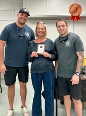 Treasure Island Fire Rescue members posing with the 3rd place winner of the Chili Cook-Off