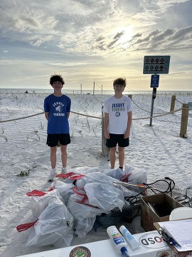 Connor pictured with some volunteers at Connor's Neighborhood Cleanup