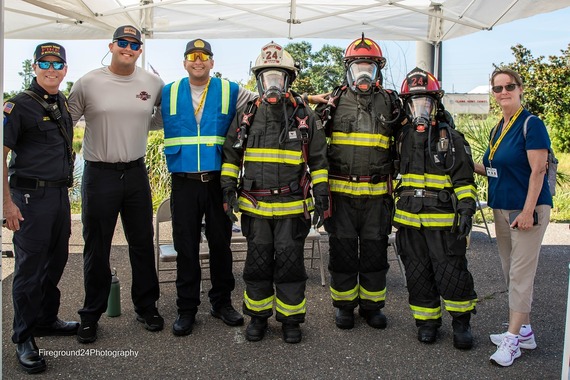 Treasure Island city leaders, staff and firefighters pose for a picture