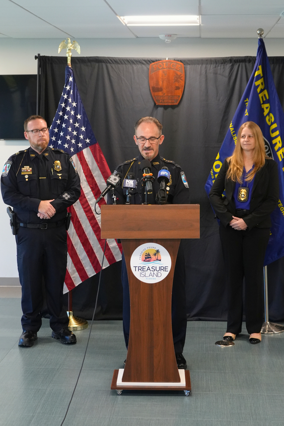 TIPD Chief Barkley speaking at a podium during a news conference