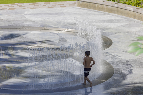 Child playing in kids' fountain in west palm beach 