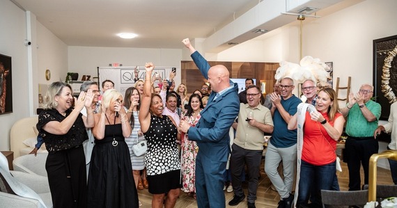 quaban grand opening in northwood village, group photo of celebration in front of the studio
